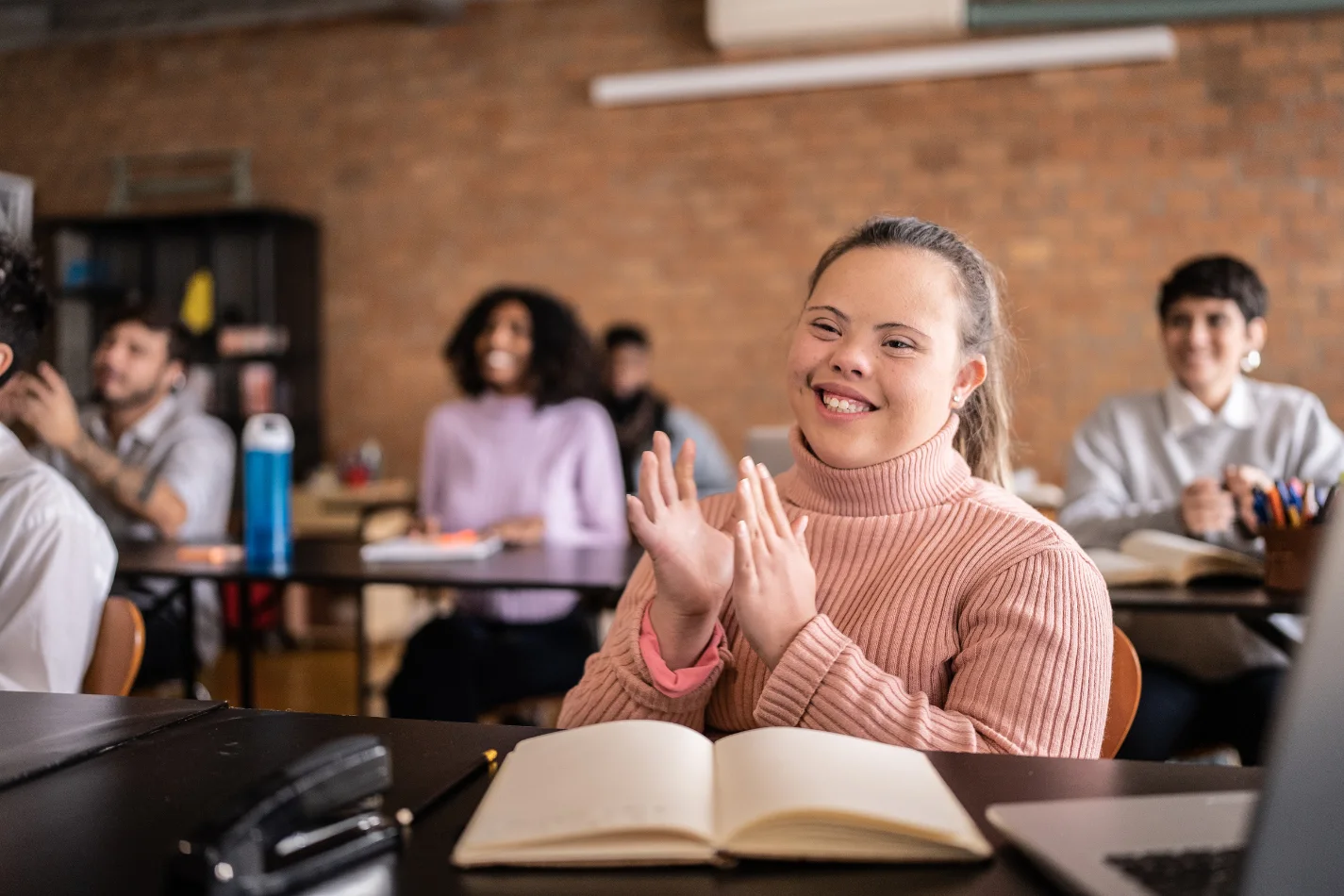 Disabled woman with down syndrome in class