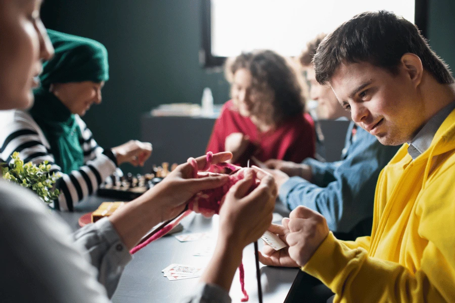 Disabled man in knitting class