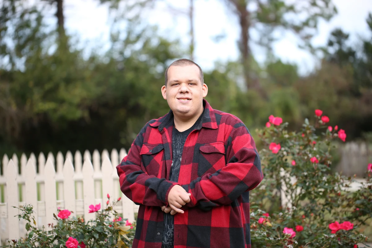Disabled man smiling at camera